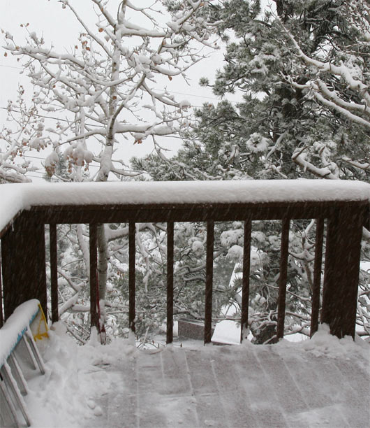 The top of stairs with more snow