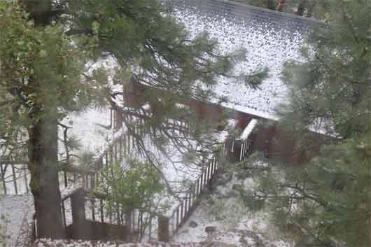 The front stairs and garage covered in white.