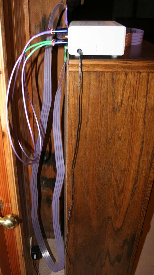 pic of cables hanging off back of DVD bookcase