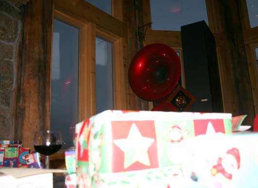 Christmas presents and a glass of wine with the Triolons in the background